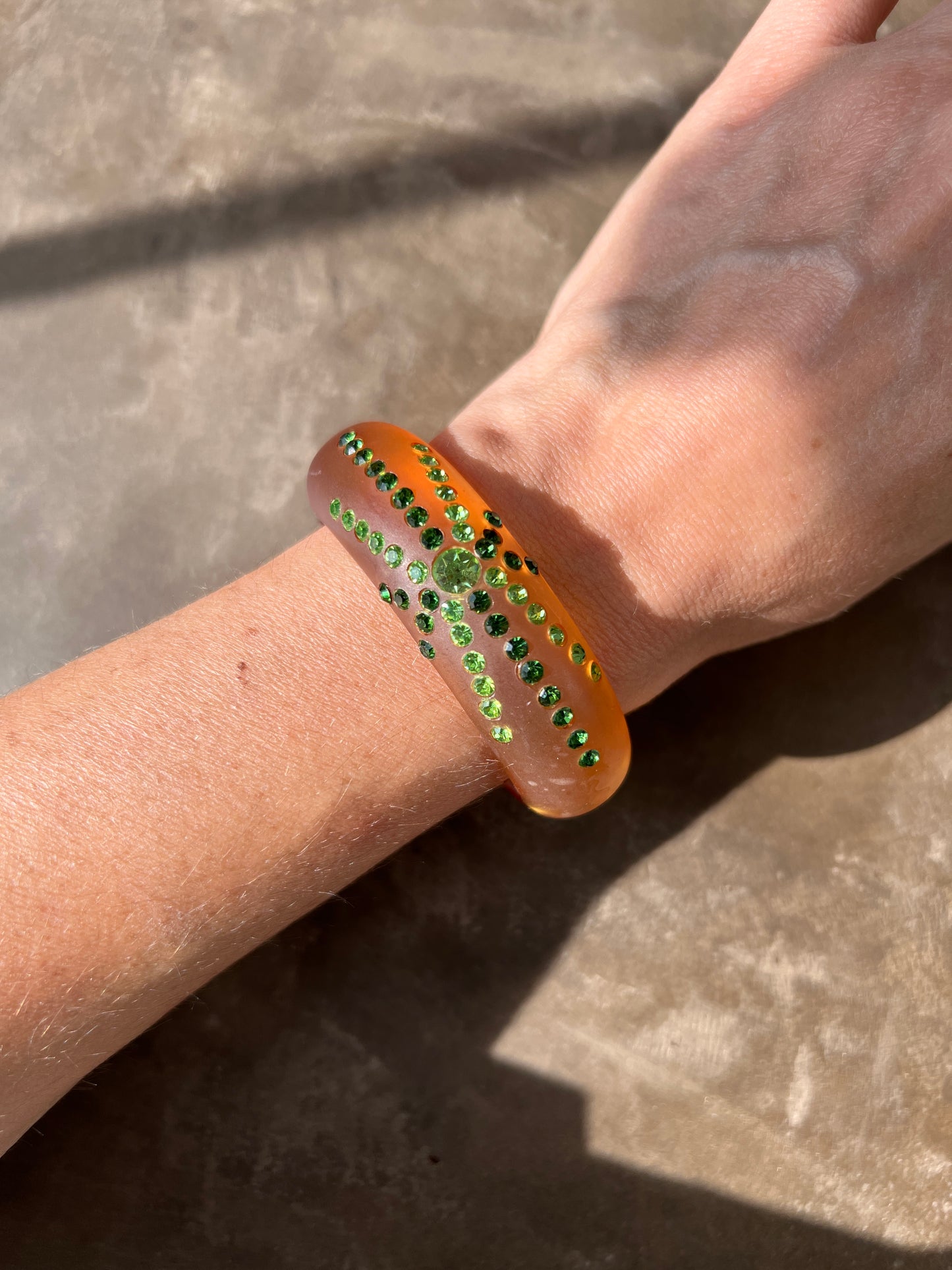 1950s Amber Lucite Clamped Bangle with Green Rhinestones