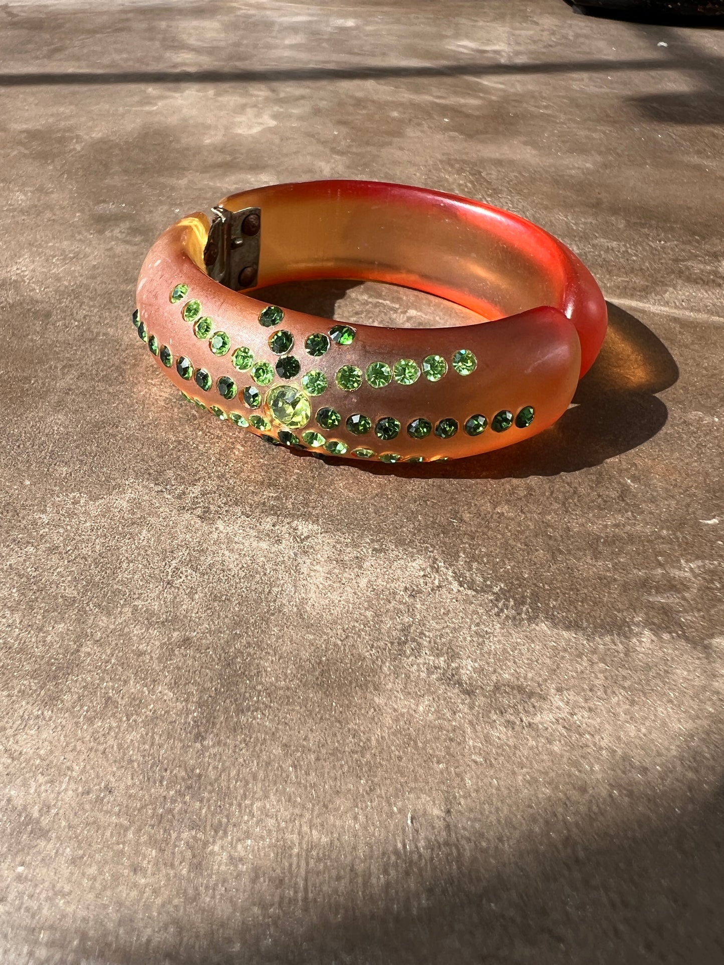 1950s Amber Lucite Clamped Bangle with Green Rhinestones
