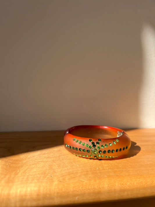 1950s Amber Lucite Clamped Bangle with Green Rhinestones